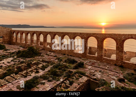 Ruins of industrial mining along the west coast of Sardinia. Panorama at sunset. The Marmora washery. Stock Photo