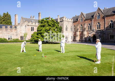 Playing croquet on the lawns of the Bishops Palace in the cathedral city of Wells, Somerset UK Stock Photo