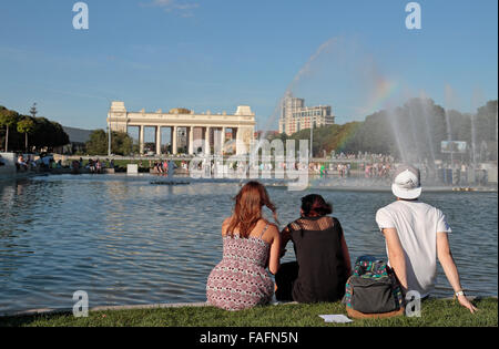 People sitting beside the main lake in Gorky Park, Moscow, Russia. Stock Photo