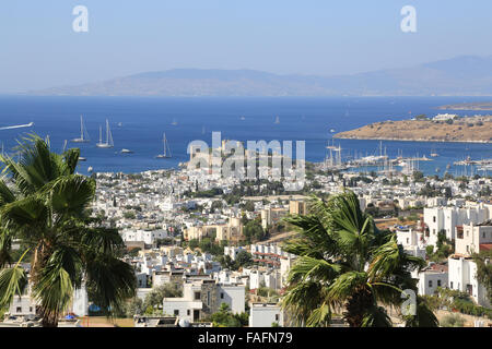 View across sea Bodrum Bay town, castle and harbour harbor port in Turkey from hillside in Summer sunshine Stock Photo