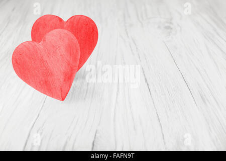 Wooden red hearts on white background, space for text. Stock Photo