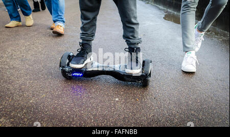 Person Riding a HoverBoard on a Public Footpath, They are now banned in all public places in the United Kingdom Stock Photo