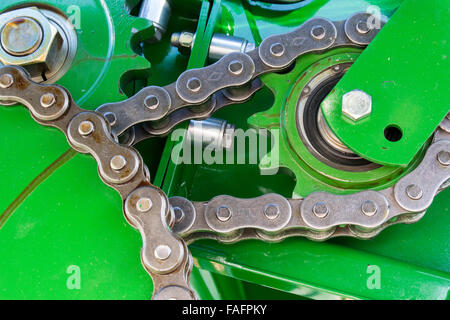 Internal workings of a big baler, showing cogs and chains. Stock Photo