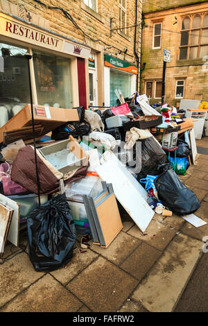Hebden Bridge, UK. 29th Dec, 2015. Contents of a shop piled up on the street in Hebden Bridge Credit:  Graham Hardy/Alamy Live News Stock Photo