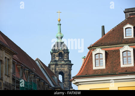 View towards upper part of bell tower of Church of the Cross (Kreuzkirche) from eastern side between roofs of Keuzstrasse Street Stock Photo