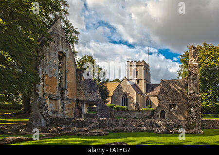 Ruins of Minster Lovell Hall standing beside St Kenelms church, Minster Lovell, England. On a summers day Stock Photo