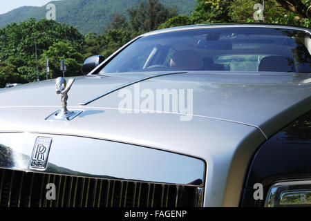 Rolls-Royce brand woman found in Ghost high class sedan. Stock Photo