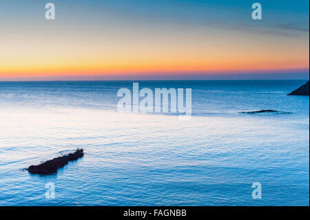 Sunrise over the calm beautiful water in Es Canar, Ibiza, part of the Balearic Islands in Spain,Europe. Stock Photo