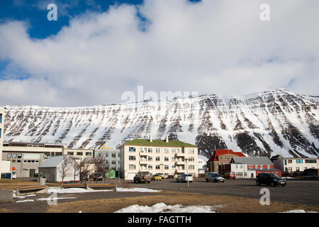 Buildings in the center of Isafjordur town backed by the cliffs of the fjords in westfjords region of Iceland Stock Photo