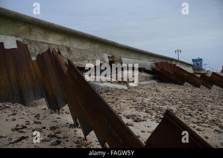 Damage caused by bad weather to the sea wall on the promenade at Southsea, Hampshire, England. Stock Photo