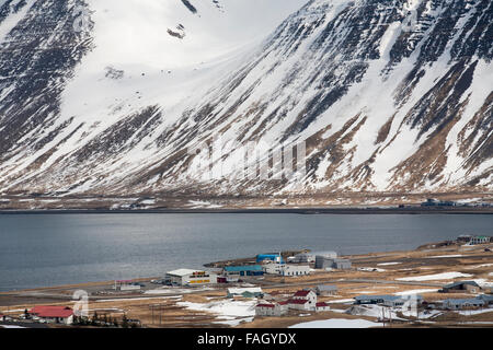 The town of isafjordur against the dramatic hills and mountains behind in the west Fjords of northern Iceland Stock Photo