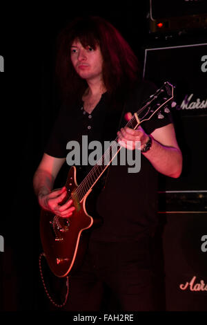 Dundee, Tayside, Scotland, UK, December 29th 2015. AC/DC Tribute rock band “AC/DC UK” play live at the Beat Generator nightclub in Dundee. Rhythm guitarist Bill Voccia (Malcolm Young). © Dundee Photographics / Alamy Live News. Stock Photo