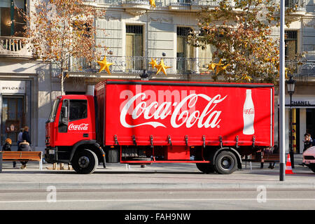 Red Coca-Cola delivery truck parked in the street, in the Passeig de Gracia at Barcelona, Stock Photo