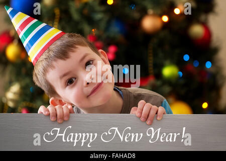 Happy New Year 2016 - boy on a Christmas tree background Stock Photo