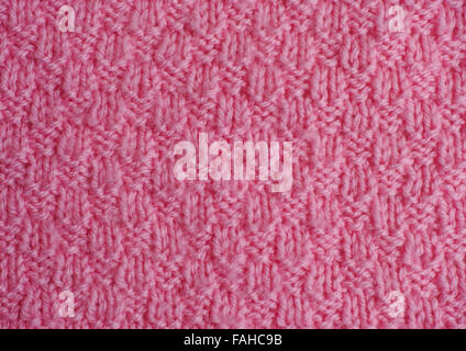 Pink hand knitted texture, Close-up. Stock Photo