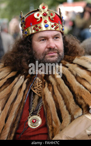 Bearded man dressed as King Charles IV of Bohemia and Holy Roman Emperor wearing the Crown of Saint Wenceslas attends the annual young wine festival Vinohradske Vinobrani in Prague, Czech Republic. Stock Photo