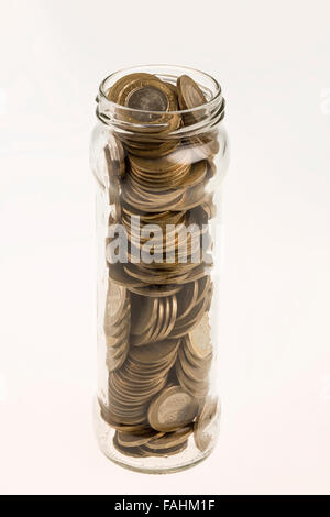 A jar of Turkish coins on isolated white background Stock Photo