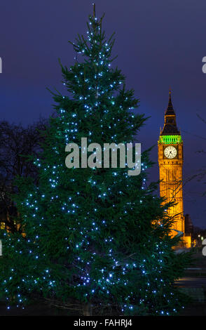 A Christmas Tree with the Elizabeth Tower in the background, in London. Stock Photo