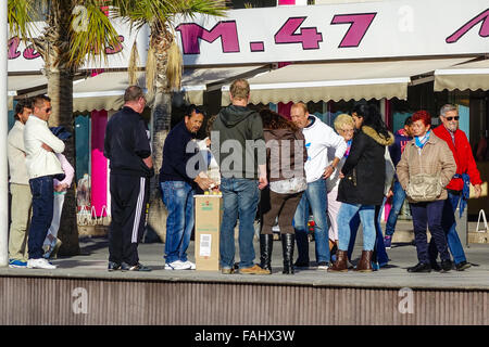 Pea men, peamen, shell men, con men, most of the people in this picture are part of the game to trap tourists in Benidorm Stock Photo