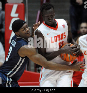 Albuquerque, NM, USA. 30th Dec, 2015. Nevada's #0 Cameron Oliver reaches food the ball that was rebounded by UNM's #11 Obij Aget. Wednesday, Dec. 30, 2015. © Jim Thompson/Albuquerque Journal/ZUMA Wire/Alamy Live News Stock Photo