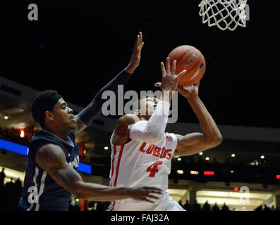 Albuquerque, NM, USA. 30th Dec, 2015. UNM's #4 Elijah Brown takes the ball to the hoop against Nevada's #0 Cameron Oliver. Wednesday, Dec. 30, 2015. © Jim Thompson/Albuquerque Journal/ZUMA Wire/Alamy Live News Stock Photo