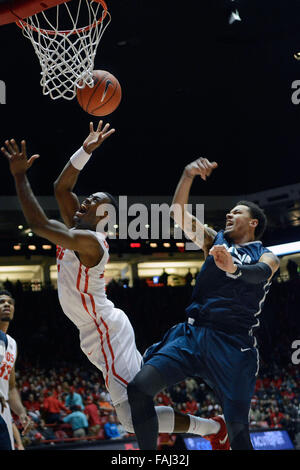 Albuquerque, NM, USA. 30th Dec, 2015. UNM's #20 Sam Logwood gets fouled by Nevada's #5 Kaileb Rodriguez as he takes the ball to the hoop. Wednesday, Dec. 30, 2015. © Jim Thompson/Albuquerque Journal/ZUMA Wire/Alamy Live News Stock Photo