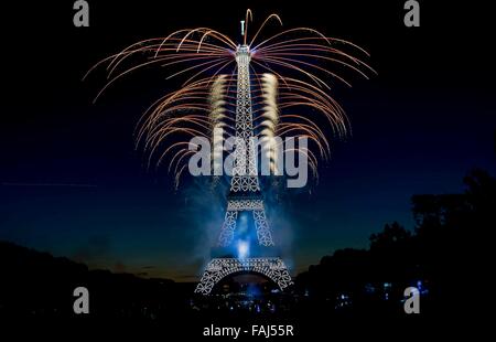 Beijing, France. 14th July, 2015. Fireworks are seen lightening the Eiffel Tower during the Bastille Day celebrations in Paris, capital of France, July 14, 2015. © Chen Xiaowei/Xinhua/Alamy Live News Stock Photo