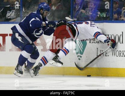 Tampa, Florida, USA. 30th Dec, 2015. DOUGLAS R. CLIFFORD | Times.Tampa Bay Lightning right wing Nikita Kucherov (86), left, buries New York Rangers right wing Mats Zuccarello (36) into the boards during the third period of Wednesday's (12/30/15) game at the Amalie Arena in Tampa. Credit:  Douglas R. Clifford/Tampa Bay Times/ZUMA Wire/Alamy Live News Stock Photo