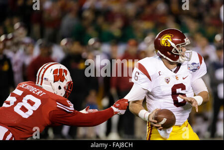 San Diego, California, USA. 30th Dec, 2015. Wisconsin Badgers OLB Joe Schobert #58 gets a piece of University of Southern California QB Cody Kessler #6 during the National Funding Holiday Bowl NCAA football game between the University of Southern California Trojans and the Wisconsin Badgers at Qualcomm Stadium in San Diego, California. Wisconsin defeats USC 23-21. Justin Cooper/CSM/Alamy Live News Stock Photo