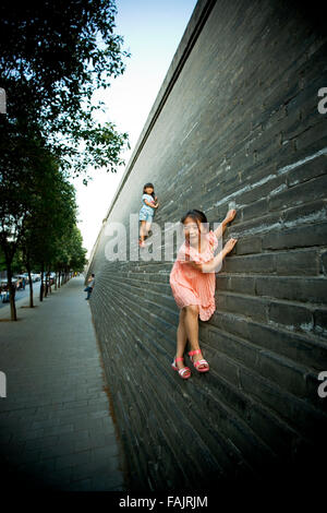 Girls playing on Xian city wall, China. Stock Photo