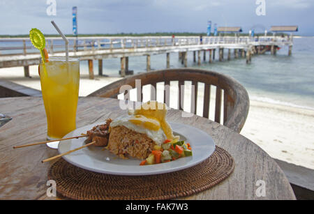 Local lunch whilst waiting for the boat to arrive from Bali at the jetty on Gili Islands, Indonesia Stock Photo