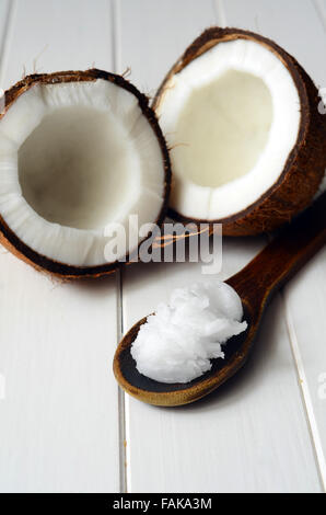 Coconut with coconut oil in a spoon Stock Photo