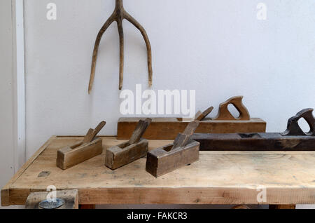 Vintage or Old Wood or Wooden Planes Saws & Bench Used for Carpentry or Woodwork Stock Photo