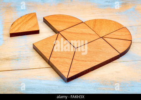 heart version of tangram, a traditional Chinese Puzzle Game made of different wood parts to build abstract figures from them, pa Stock Photo