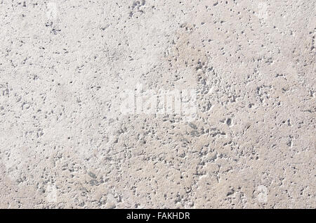 Concrete stone background texture in sunny afternoon light. Stock Photo