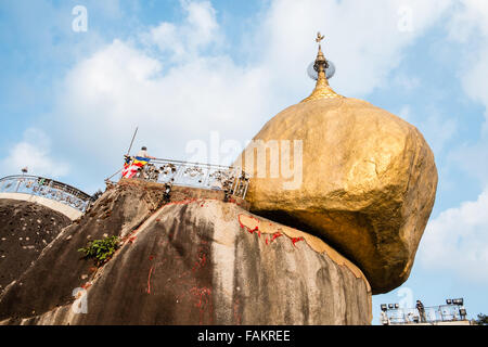 Famous,pagoda,on,place,of,worship,pilgrimage,for,Buddhist,and tourists at,golden,gold,precariously,balanced,rock,Myanmar,Burma,gold,Kyaitiyo,Buddhist, Stock Photo