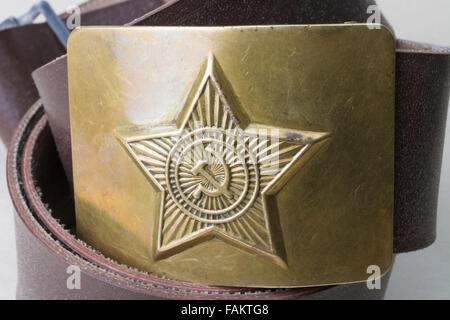 Russian brass belt buckle with embossed sickle, star and hammer from Soviet era Stock Photo
