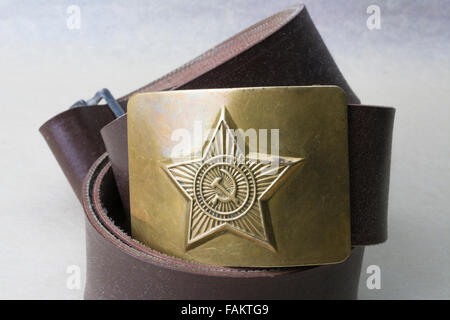 Russian brass belt buckle with embossed sickle, star and hammer from Soviet era Stock Photo