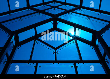 It's a big windows which made from many pieces of blue glasses. The structure and frame made by metal materials. This window wil Stock Photo