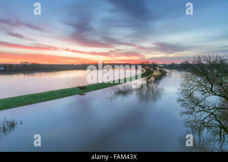 Clifton Ings, York, UK. 01st Jan, 2016. View from Clifton Bridge on the ring road over river Ouse and distant York Minster at dawn on New Year's Day 2016. The flood water is receding. Credit:  John Potter/Alamy Live News Stock Photo