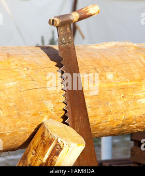 Saw and wood Stock Photo