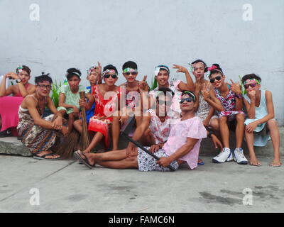 Philippines. 01st Jan, 2016. 'Aguman Sandok Festival' or 'Belles of Minalin' is the annual festival of Minalin, Pampanga where men cross-dress and they go dancing in the streets on New Year's Day to give laughter to towns-mates. The festival started in 1932 after the town had experienced extreme drought in 1931: to welcome 1932 with a big bang and to make the people smile after the calamity, a group of men started the new year of 1932 by wearing dress and it became a tradition every year for more than eight decades now. © Sherbien Dacalanio/Pacific Press/Alamy Live News Stock Photo