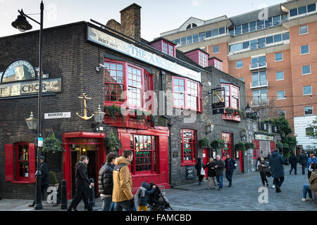 People walk past the historic pub, The Anchor on the South Bank in London. Stock Photo