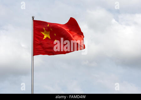 Chinese flag blowing in wind Stock Photo