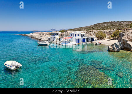 Traditional fishermen houses with the impressive boat shelters, also known as “syrmata” in Mytakas of Milos, Greece Stock Photo
