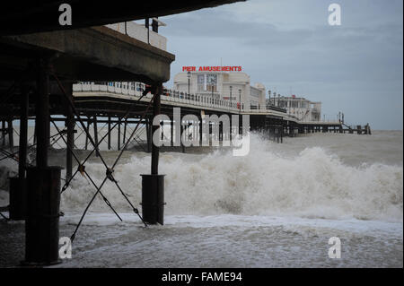 Large waves crash onto the beach under Worthing Pier on New Years Day in Worthing, West Sussex, England. Stock Photo