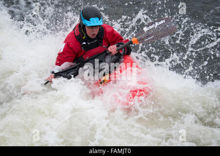 Woman kayaking in fast water Stock Photo