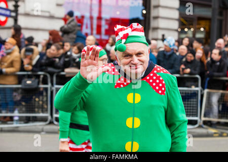 London, UK. 1st January, 2016. A performer waves on Picadilly Circus, at the 30th annual London's New Year's Day Parade, LNYDP 2016. The parade has more than 8,500 performers representing 20 countries world-wide, including marching bands, cheerleaders, clowns, acrobats and representatives of the London Boroughs. Credit:  Imageplotter/Alamy Live News Stock Photo