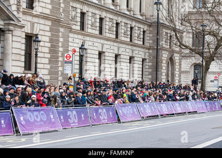London, UK. 1st January, 2016. Spectators along Whitehall at the the 30th annual London's New Year's Day Parade, LNYDP 2016. The parade has more than 8,500 performers representing 20 countries world-wide, including marching bands, cheerleaders, clowns, acrobats and representatives of the London Boroughs. Credit:  Imageplotter/Alamy Live News Stock Photo