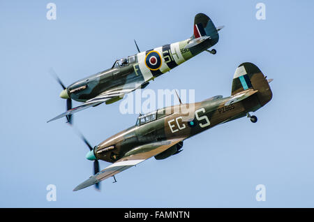 Supermarine Spitfire and Hawker Hurricane of the RAF's Battle of Britain Memorial Flight at the Goodwood Revival 2015. Second World War fighters Stock Photo